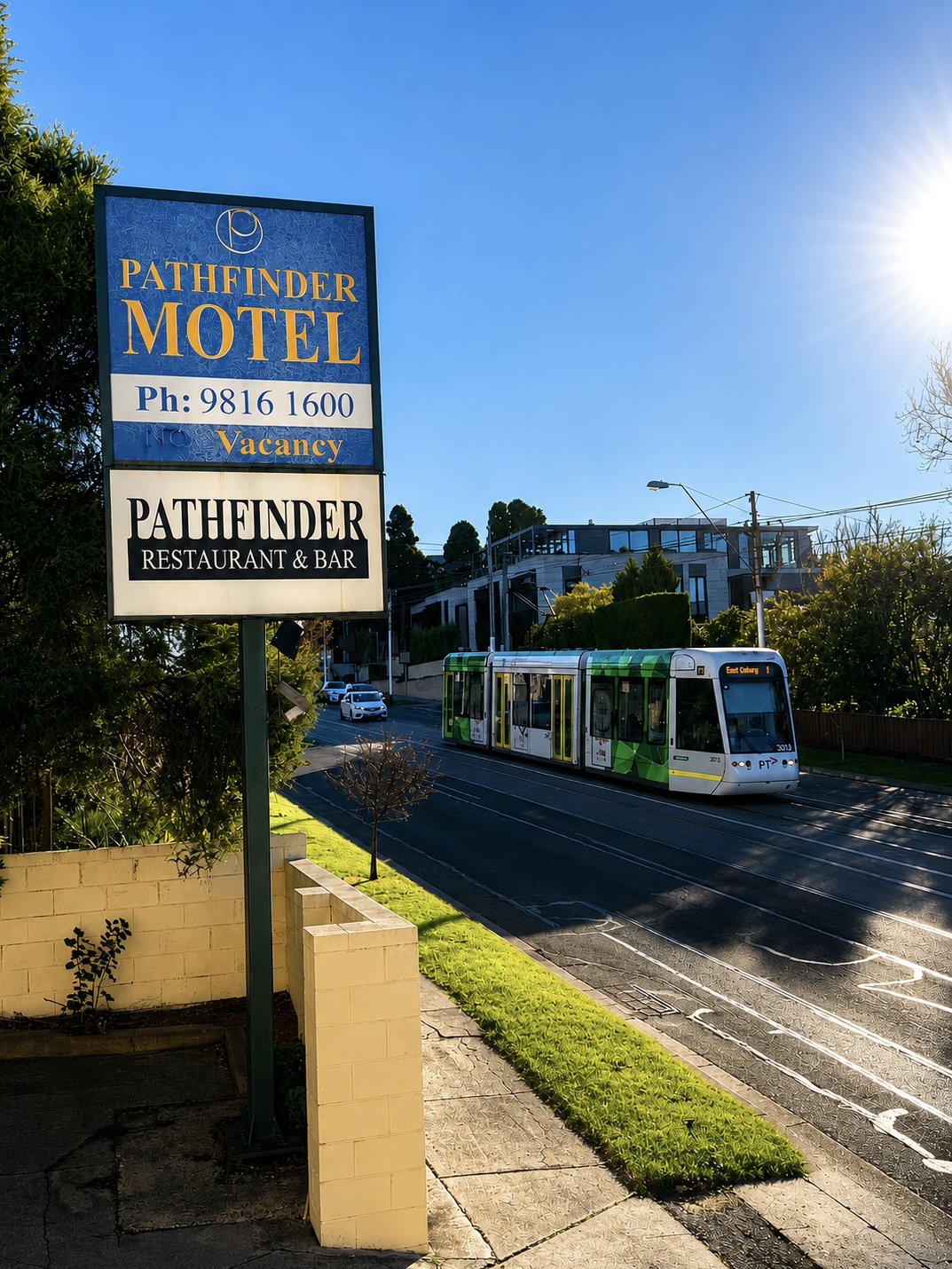 Pathfinder Motel street sign with Route 109 tram on Cotham Road